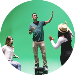 Students acting in front of a green screen